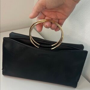 Coco + Carmen Black Clutch with Gold Rings